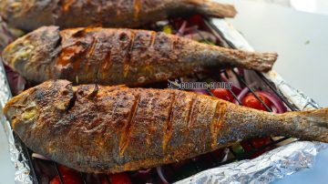 Tasty Oven Grilled Whole Sea Bream with Tomatoes and Onion